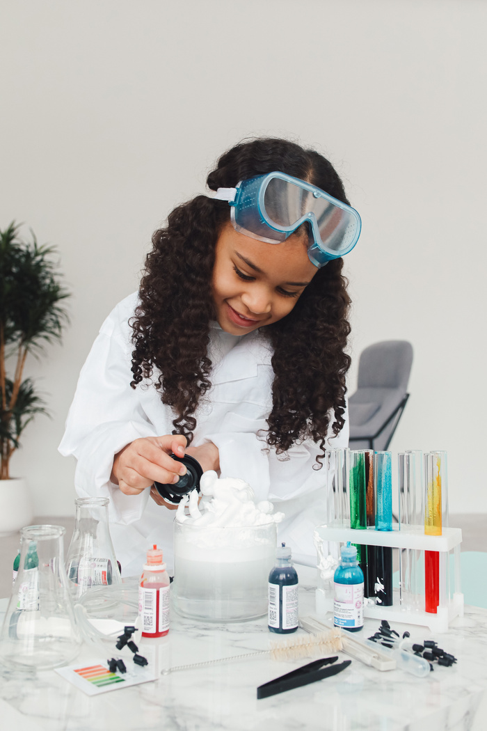 Girl Doing Science Experiment with Dyes